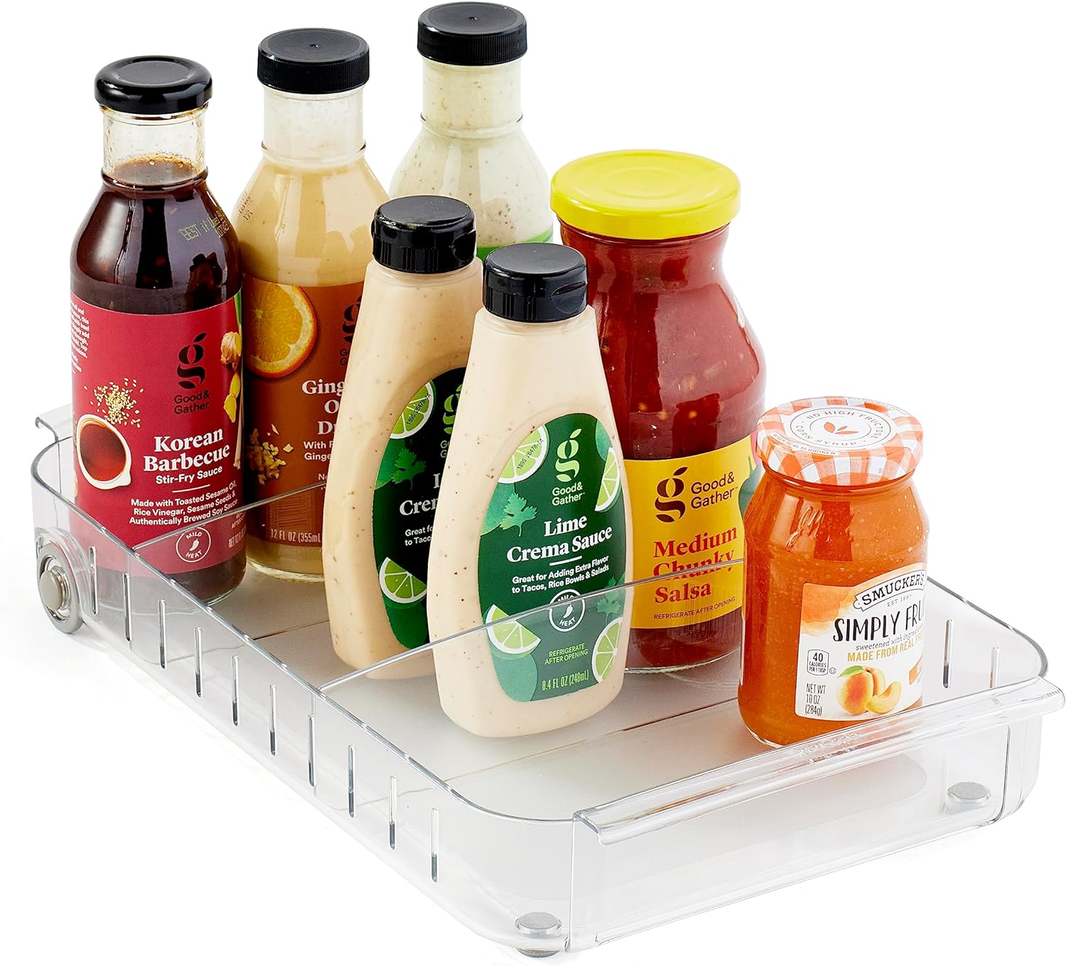 YouCopia-style clear rolling refrigerator caddy pulled out from fridge shelf holding snacks and bottles